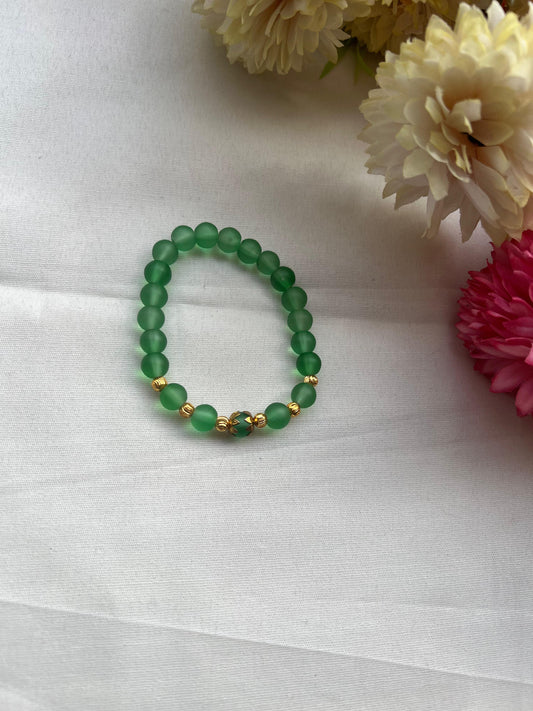 Green Bead Bracelet with Gold Accent Beads